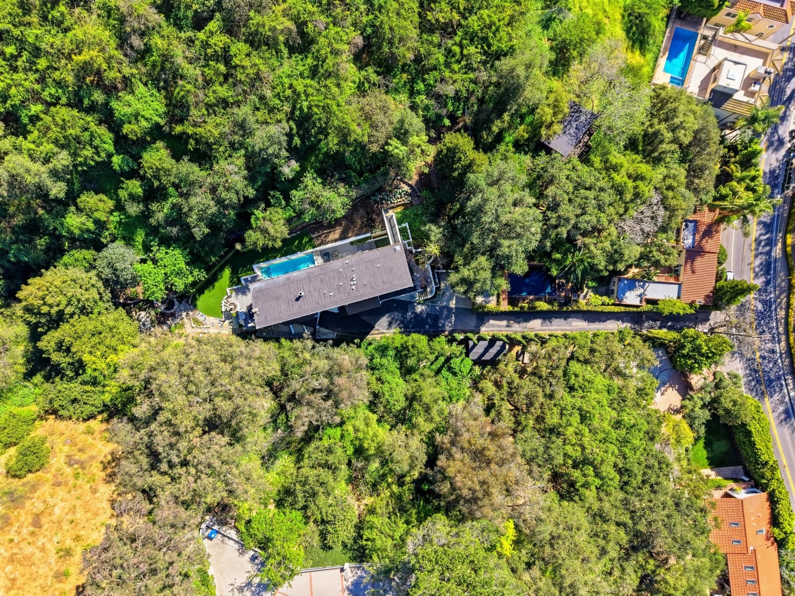 Aerial context view of a Beverly Hills estate with a pool on Benedict Canyon Drive