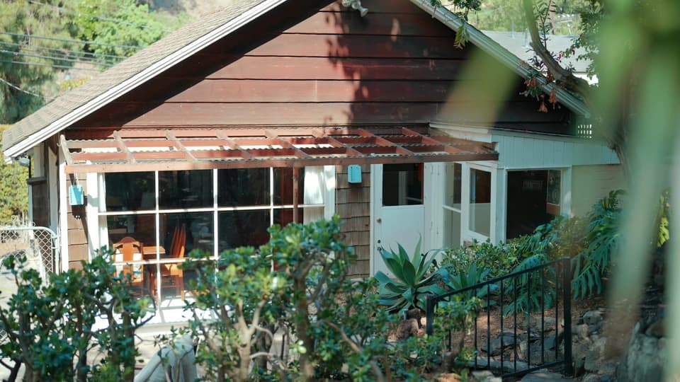 Craftsman cottage exterior and sunroom at 947 N Beverly Glen Blvd
