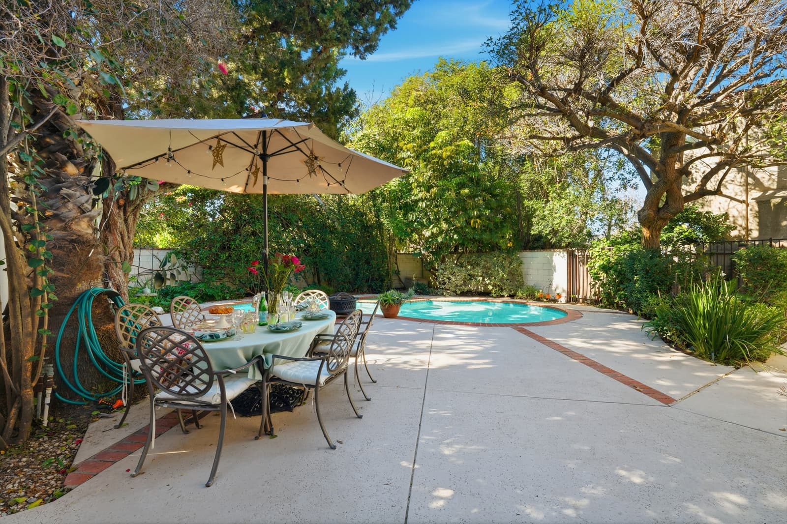 Backyard pool and patio at an Encino home