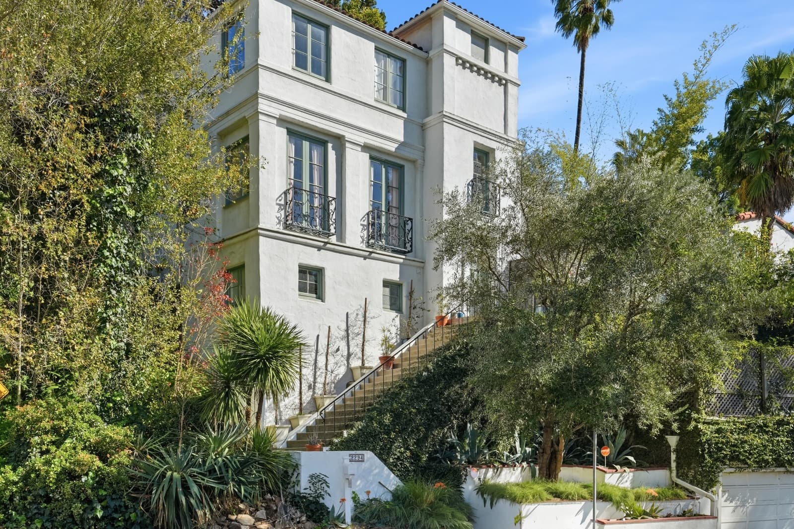 Mediterranean-style exterior of a Hollywood Hills listing, photographed by VVT