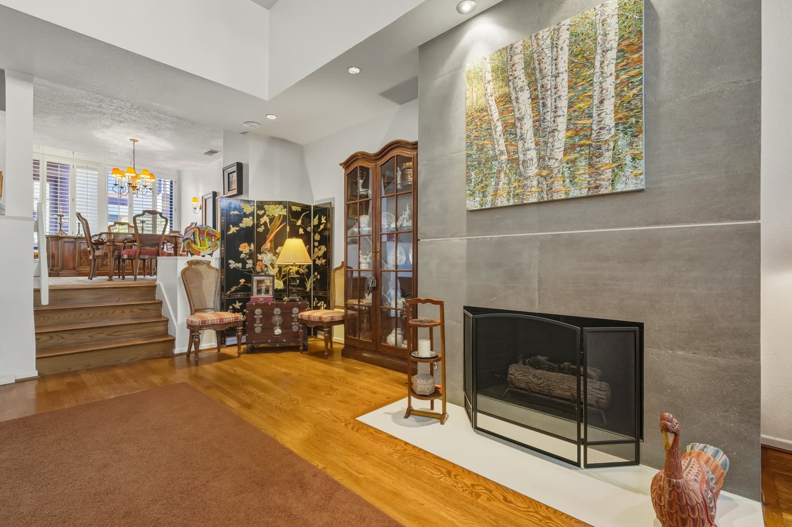 Traditional living room with a fireplace and staircase