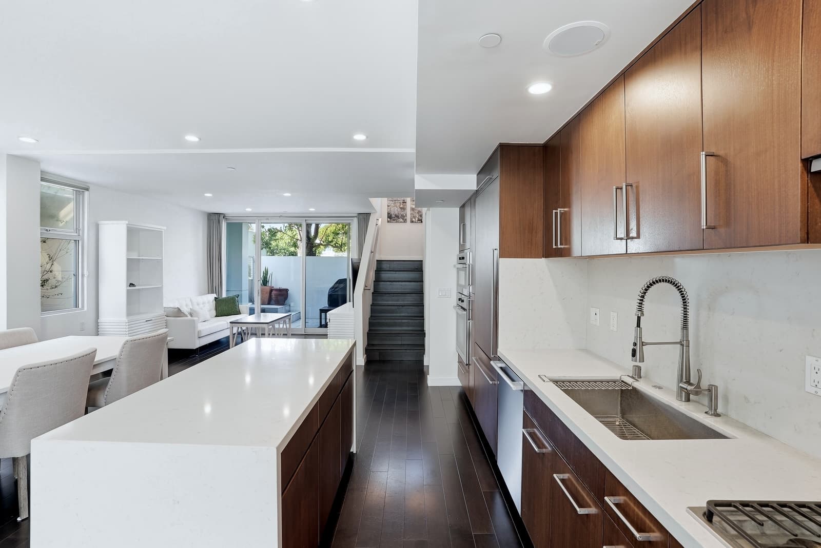 Modern kitchen and living space in a Santa Monica listing, photographed by VVT
