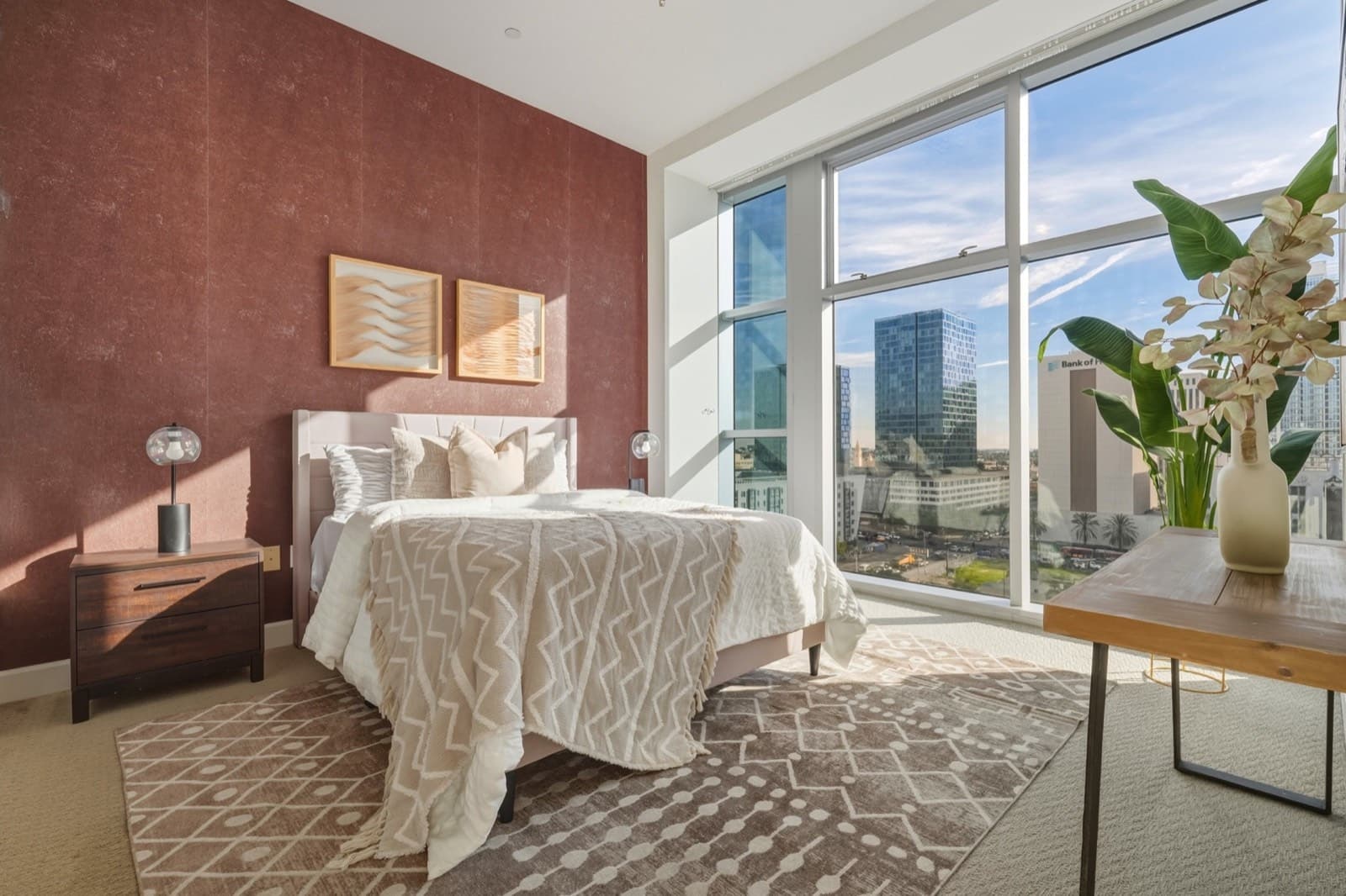 Primary bedroom in daylight in the Koreatown high-rise unit